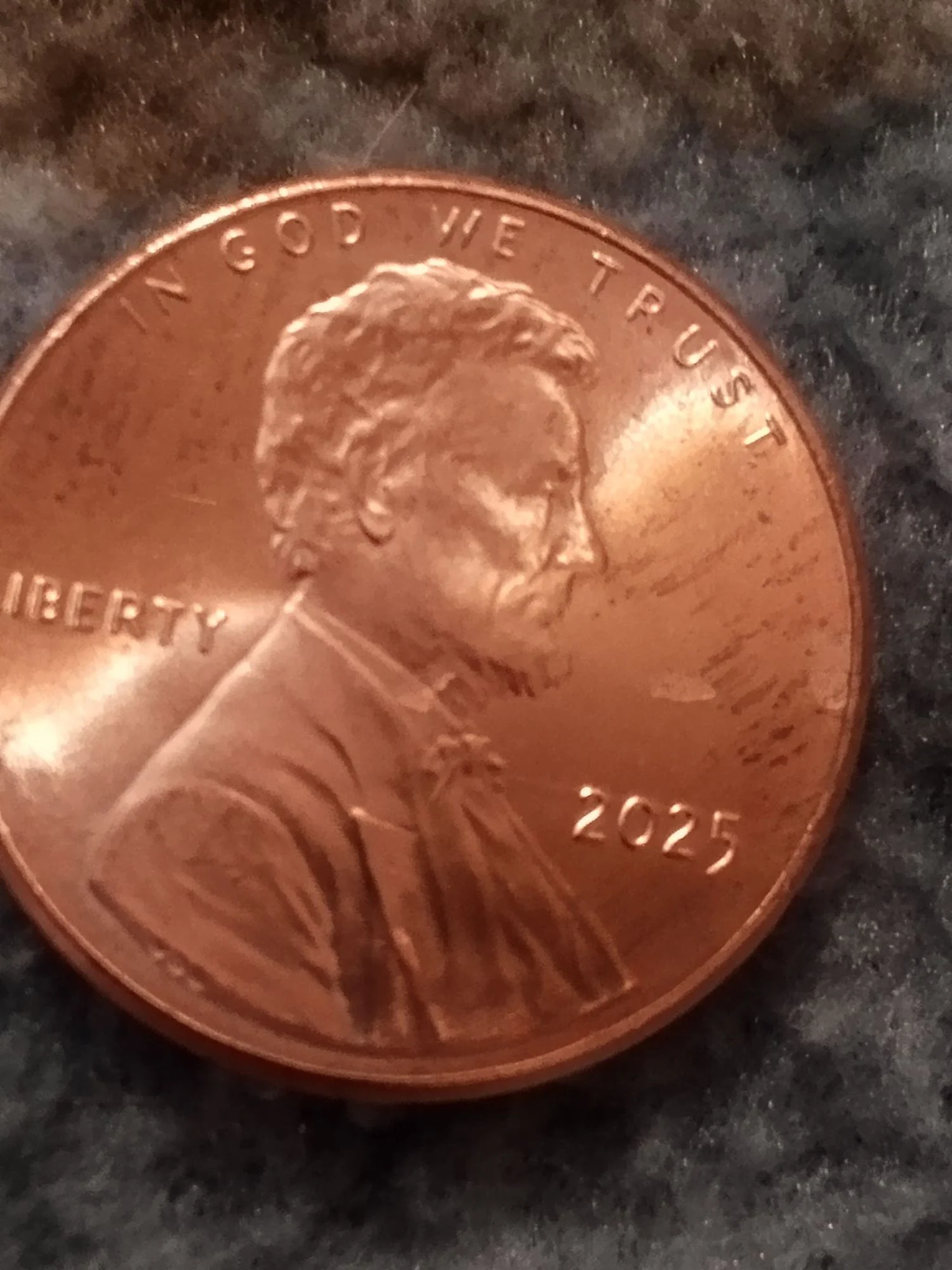 2025 penny off-center strike error showing approximately 35 percent displacement with the date still visible